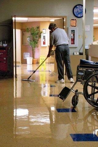 A Man cleaning a health facility